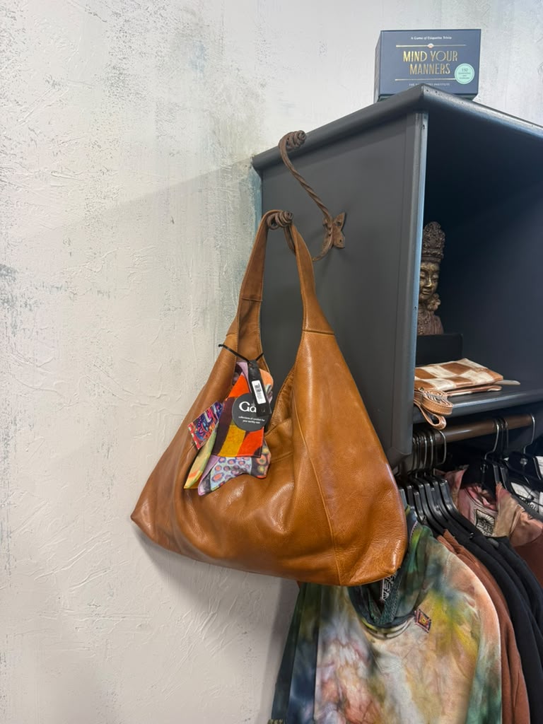 A leather bag on a hook at Gaia